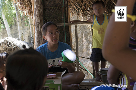 Toni Munar, our adaptive technologies specialist from WWF-Philippines is showcasing the solar lamps to the local communities